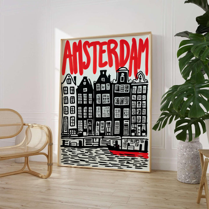 Graphic linocut art print of carved gabled canal houses in black ink with red typography of Amsterdam Netherlands, available from MapYourDreams where you can choose between an unframed fine art poster, museum stretched canvas, or custom frame finishes for eclectic bedroom styling.