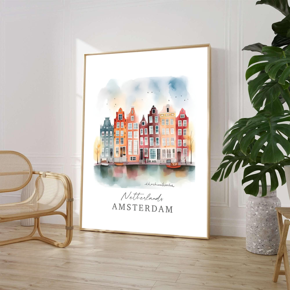 Whimsical watercolor cityscape print of gabled Dutch townhouses and canal water reflections in Amsterdam Netherlands, available from MapYourDreams where shoppers can choose between unframed fine art posters, gallery canvas prints, and custom frame options for living room walls.