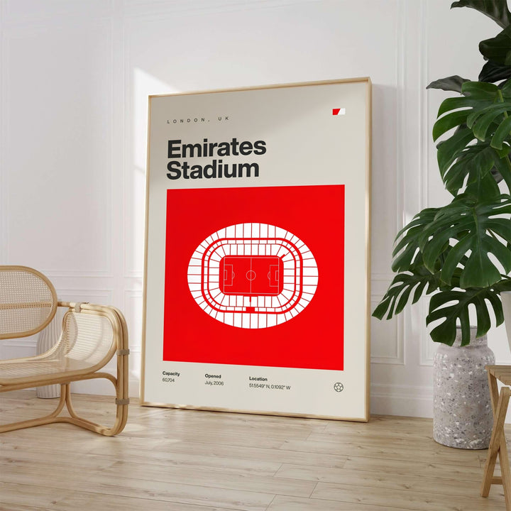 Minimalist Swiss style architectural poster showing the pitch and seating schematic of Emirates Stadium over a bold red block and cream backdrop. Available through MapYourDreams, this sports decor piece is supplied in versatile forms such as archival paper prints, custom wooden frames, and gallery canvas wraps.