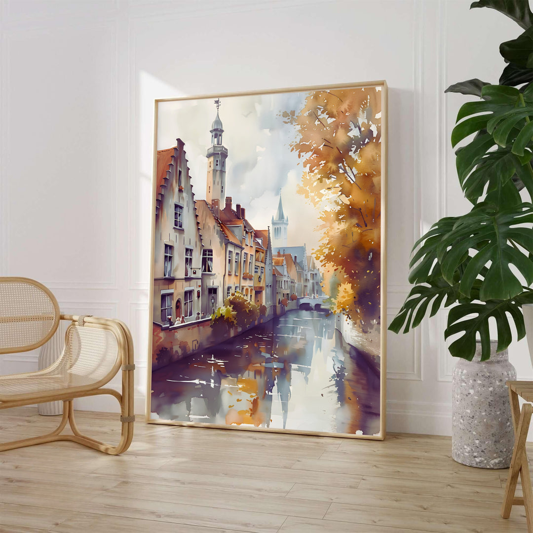 A delicate watercolor travel poster showing golden autumnal trees and historic brick architecture along a peaceful canal in Bruges, Belgium. Available from MapYourDreams in various choices like standalone unframed paper, tailored wooden frames, and gallery-wrapped canvas options.