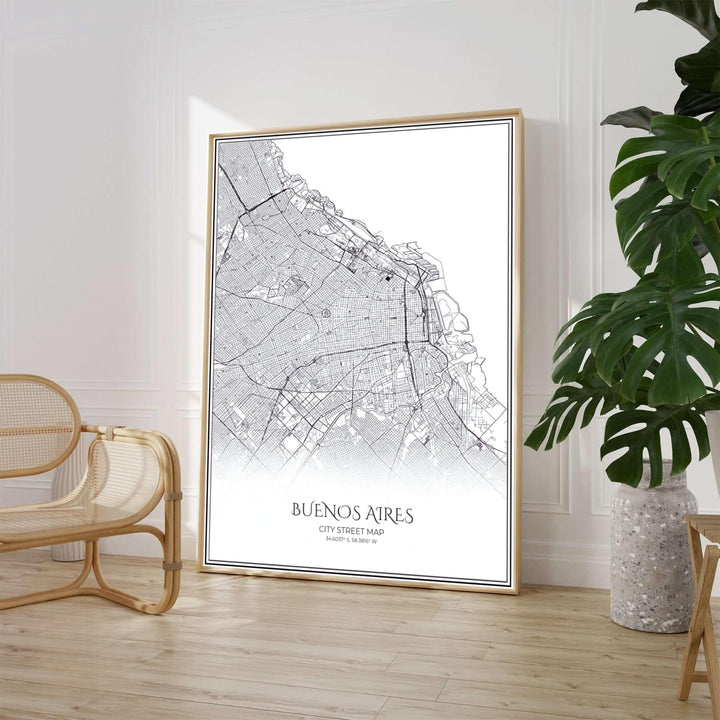 Minimalist black and white city map poster of Buenos Aires displaying the urban street grid and double-line border. Available through MapYourDreams, customers can select from fine art paper, handcrafted timber frames, or stretched canvas options.