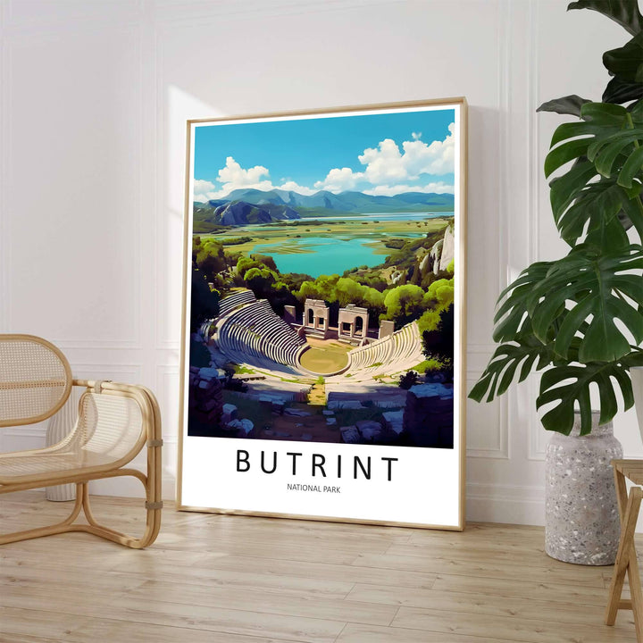 Featuring a scenic travel illustration of Butrint Albania showing Greco-Roman ruins surrounded by green trees and turquoise lake waters, this poster elevates rooms. Offered by MapYourDreams, this artwork is available in flexible options including unframed paper, custom wooden frames, and gallery canvas wraps.