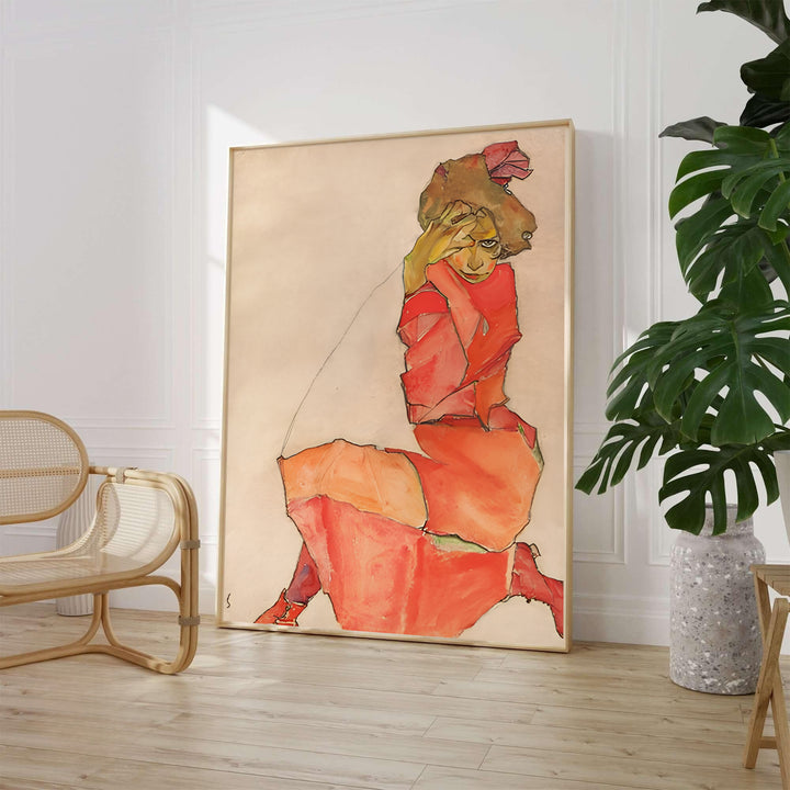Viennese Expressionist figure poster of Egon Schiele Kneeling Female In Orange Red Dress 1910 from the Leopold Museum Vienna collection with vivid crimson dress accents. Choose an unframed paper poster, a gallery stretched canvas print, or custom framed wall art directly from MapYourDreams for an artistic room decor.