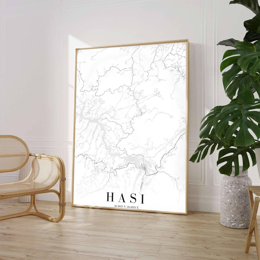 A high-contrast monochrome street map highlights the road network of Hasi, Albania, set against a clean white background with elegant serif typography. Select from flexible display choices like unframed paper stock, custom frames in various wood finishes, or gallery canvas wraps.