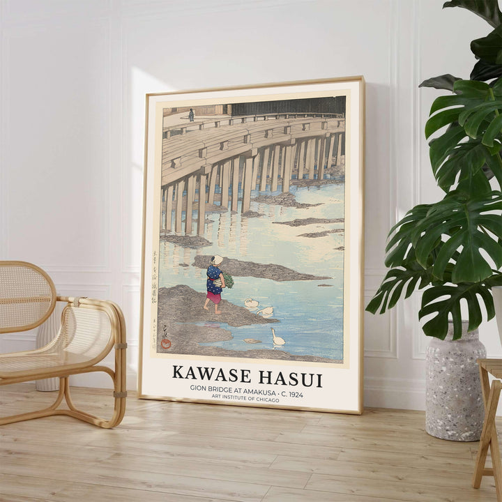 Traditional Asian stone bridge print Gion Bridge at Amakusa by artist Kawase Hasui displaying rural riverbanks at Gion Bridge in Amakusa. MapYourDreams supplies framed, unframed, and canvas poster options for wall decor.