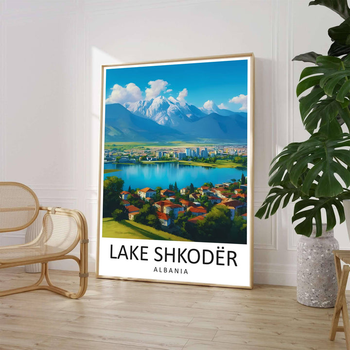 A clean mid-century travel illustration captures the expansive landscape of Lake Shkodër with terracotta-roofed hillside neighborhoods under a bright azure sky. Customers can select from unframed archival paper stock, custom wood frames, or gallery canvas wraps to suit their home decor style.