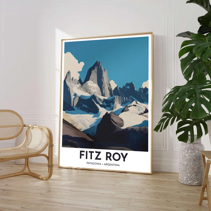 Minimalist mountain landscape wall decor displaying the towering granite peak of Mount Fitz Roy under a steel blue sky with cream clouds. Available through MapYourDreams, customers can select from fine art paper, handcrafted timber frames, or stretched canvas options.
