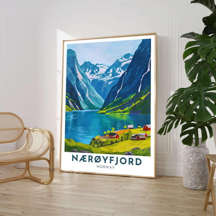 Bright summer fjord landscape depicting red farmsteads along the shore of Nærøyfjord Norway with majestic mountain slopes rising in the background. Perfect as a primary room centerpiece, this travel artwork provides flexible options including custom wood framed artwork, gallery canvas wraps, and archival unframed prints.