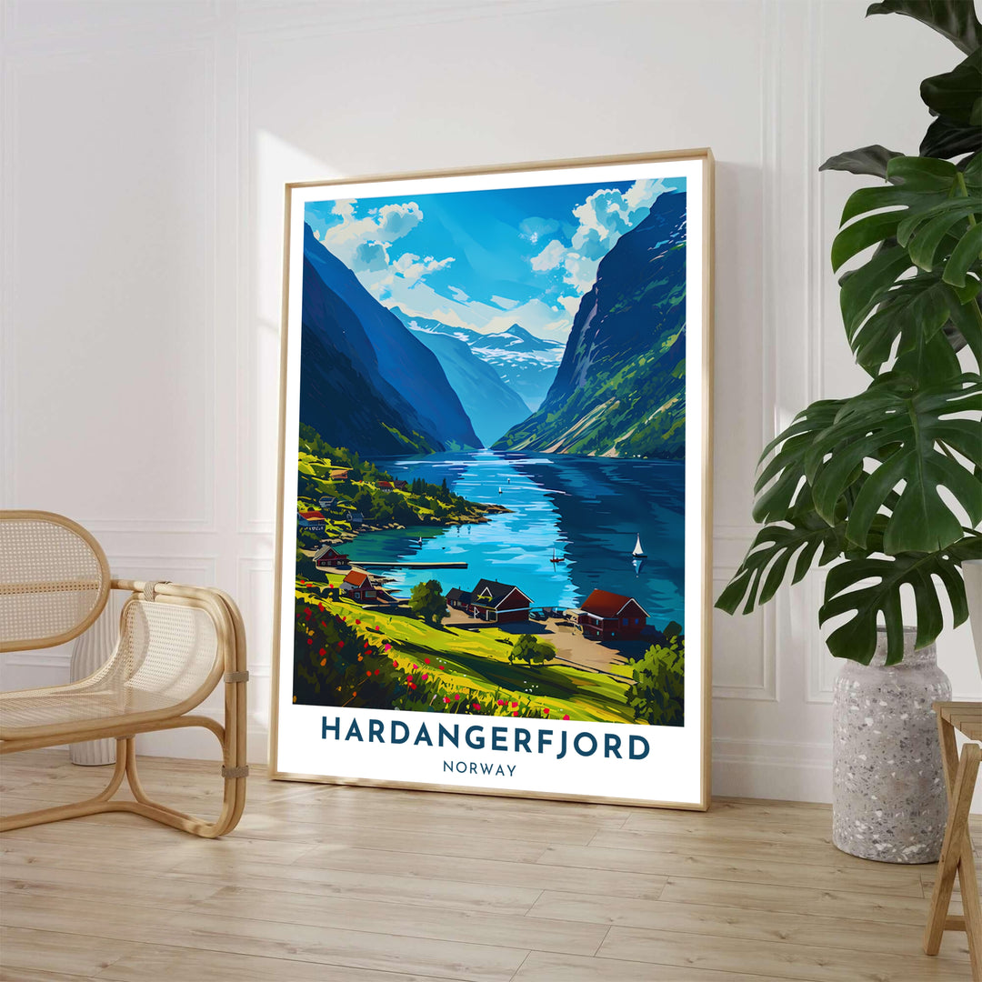 Scenic Scandinavian summer poster depicting a peaceful fjord village along Hardangerfjord Norway with blooming red flowers and calm blue waters. Perfect for home decor, this artwork is offered in multiple options including custom wood framed prints, gallery wrapped canvas, and unframed paper.
