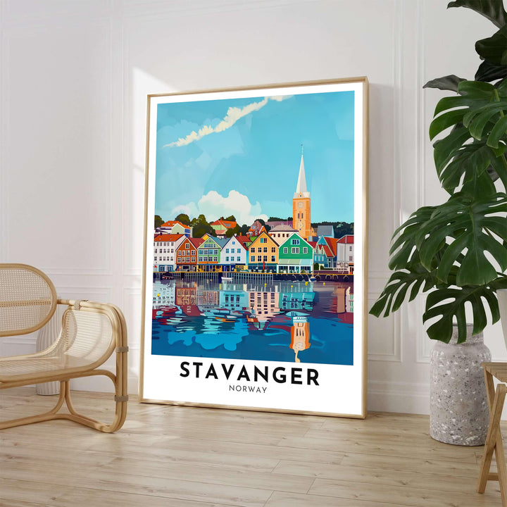 Sunny maritime illustration showcasing the Stavanger harbor waterfront in Norway with vibrant red, yellow, and green timber houses and a rising church spire. Available through MapYourDreams, this home decor piece is supplied in versatile forms such as archival paper prints, custom wooden frames, and gallery canvas wraps.