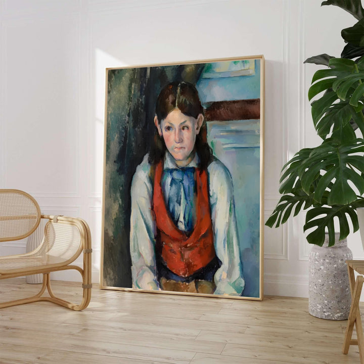 Paul Cezanne Boy In A Red Vest 1888 fine art poster created in Paris France depicting a young male in a red waistcoat and blue tie. MapYourDreams provides custom framed wall art, unframed paper prints, and gallery stretched canvas wall decor options to elevate home decor.