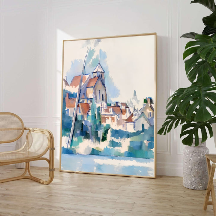 Serene waterside wall decor poster of Paul Cezanne Church At Montigny Sur Loing 1898 painted in France featuring soft blue skies and terracotta village roofs. MapYourDreams offers elegant framed prints, unframed paper posters, and stretched canvas art prints for serene room layouts.
