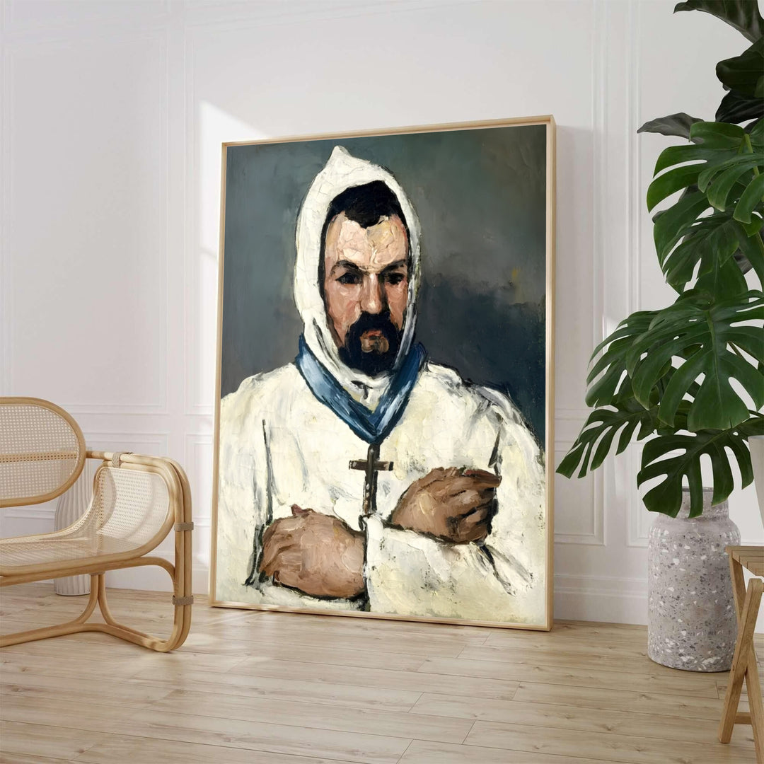 Paul Cezanne Uncle Dominique As A Monk 1866 fine art poster created in Aix-en-Provence France portraying a man in a white hooded robe with a cross. MapYourDreams provides custom framed wall art, unframed paper prints, and gallery stretched canvas wall decor options to elevate home study decor.
