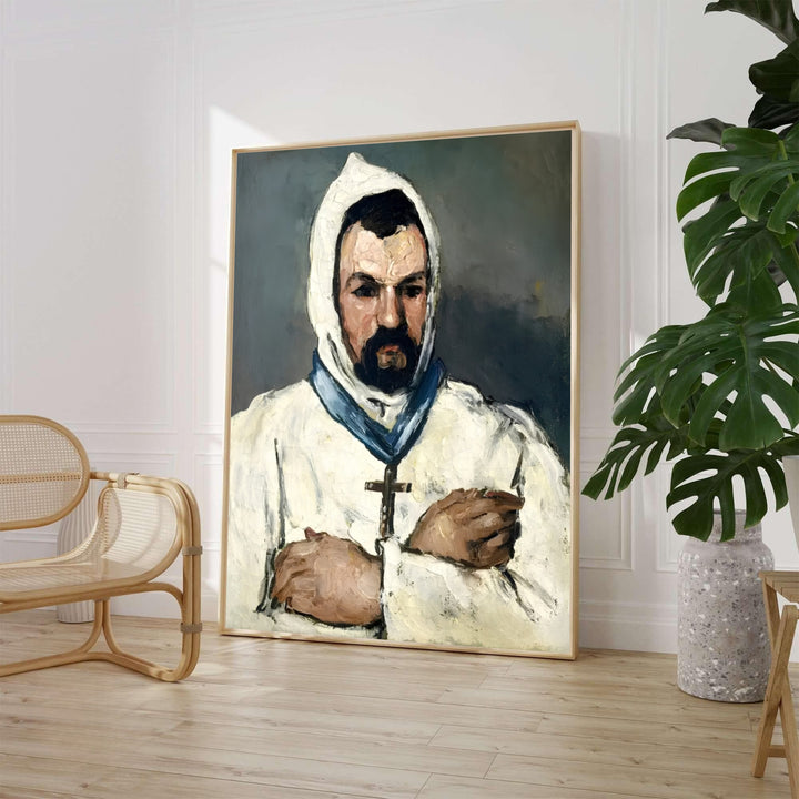 Paul Cezanne Uncle Dominique As A Monk 1866 fine art poster created in Aix-en-Provence France portraying a man in a white hooded robe with a cross. MapYourDreams provides custom framed wall art, unframed paper prints, and gallery stretched canvas wall decor options to elevate home study decor.