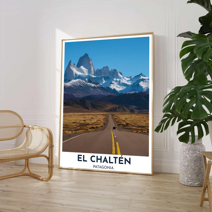 High above the vast Patagonian steppe, an iconic El Chaltén poster captures the straight highway stretching directly toward dramatic snow-dusted mountains, proudly presented by MapYourDreams across fine art paper, solid wood frames, and stretched canvas options.