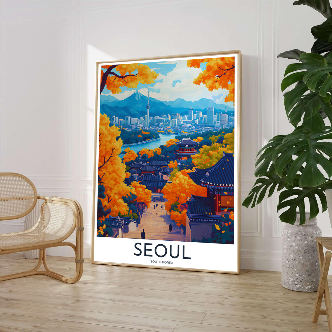 Scenic fall season art poster depicting an elevated view over Seoul, South Korea, where traditional dark-tiled Hanok roofs rest beneath vibrant orange and yellow foliage with modern city skyscrapers and N Seoul Tower in the distance. Offered by MapYourDreams, this artwork is available in flexible options including unframed paper, custom wooden frames, and gallery canvas wraps.