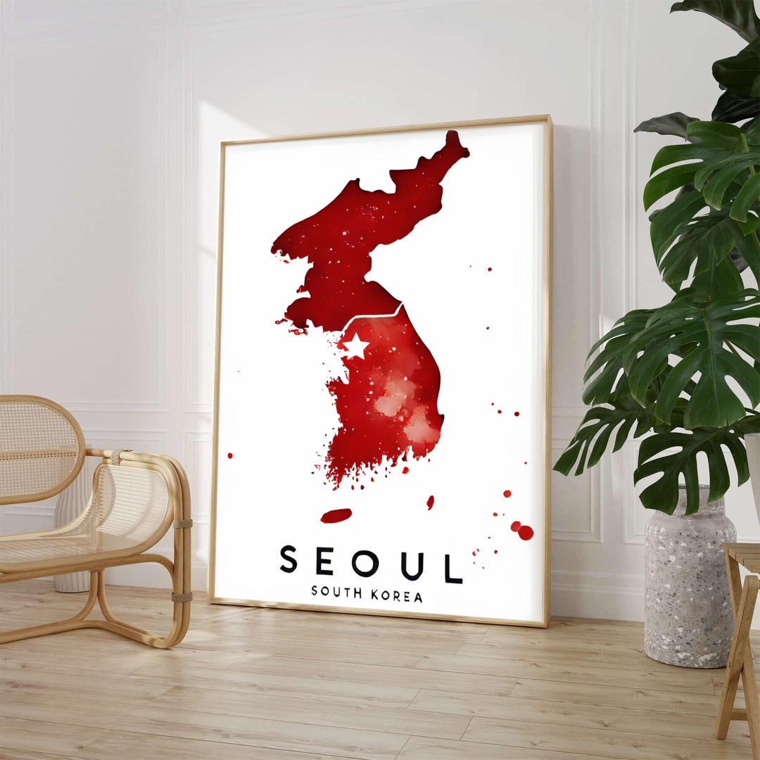 Striking crimson red watercolor map poster displaying the entire Korean peninsula with a star over Seoul, presented by MapYourDreams with versatile choices such as unframed archival paper, sleek picture frames, and stretched canvas options designed to complement contemporary room decor.