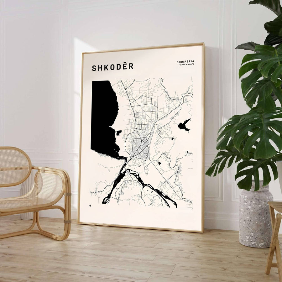 A striking hydrologic map highlights the massive lake basin and river systems of Shkodër, set against a creamy off-white background with elegant serif typography. Select from flexible display choices like unframed paper stock, custom frames in various wood finishes, or gallery canvas wraps.