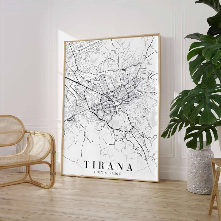A high-contrast monochrome street map highlights the extensive road network of Tirana, presented in a sleek vertical portrait orientation. Select from flexible display choices like unframed paper stock, custom frames in various wood finishes, or gallery canvas wraps.