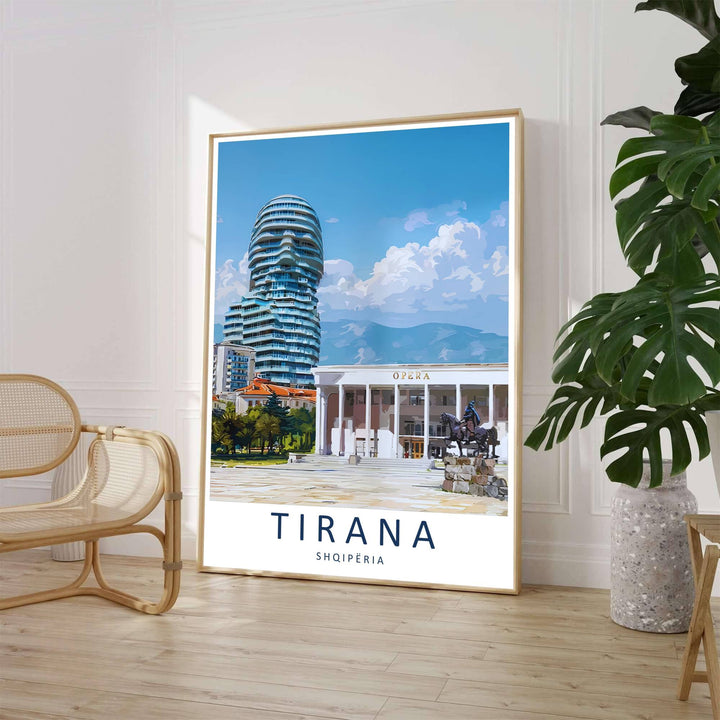A clean contemporary travel illustration captures the expansive downtown cityscape of Tirana framed by sunny plaza stones and blue skies. Customers can select from unframed archival paper stock, custom wood frames, or gallery canvas wraps to suit their home decor style.