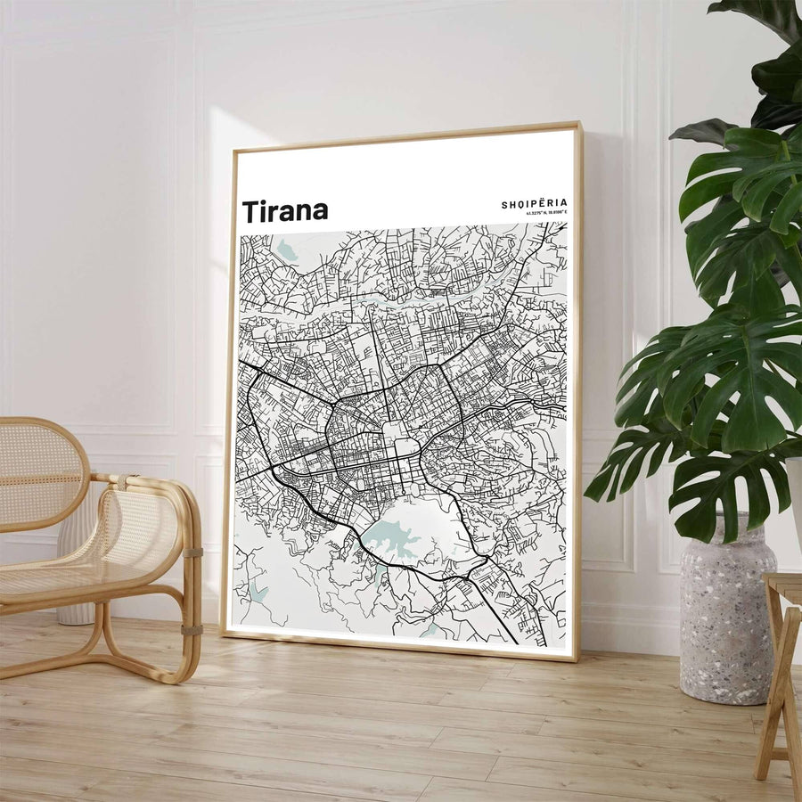 A high-contrast grey and black street map highlights the extensive road network of Tirana, presented in a sleek vertical portrait orientation. Select from flexible display choices like unframed paper stock, custom frames in various wood finishes, or gallery canvas wraps.