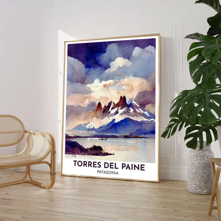 High above the serene waters of Lake Pehoé in Patagonia, an impressionistic Torres del Paine poster captures snow-dusted granite horns and misty mountain skies, proudly presented by MapYourDreams across fine art paper, solid wood frames, and stretched canvas options.