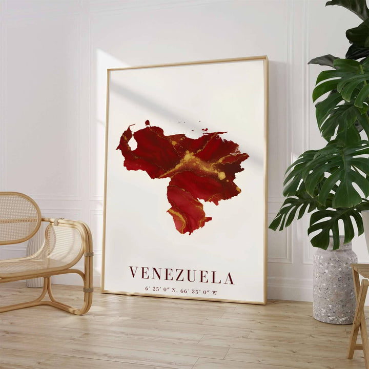 Crimson red and gold fluid ink country silhouette wall decor depicting gilded veins, marbling effects, and swirling ruby washes within Venezuela&