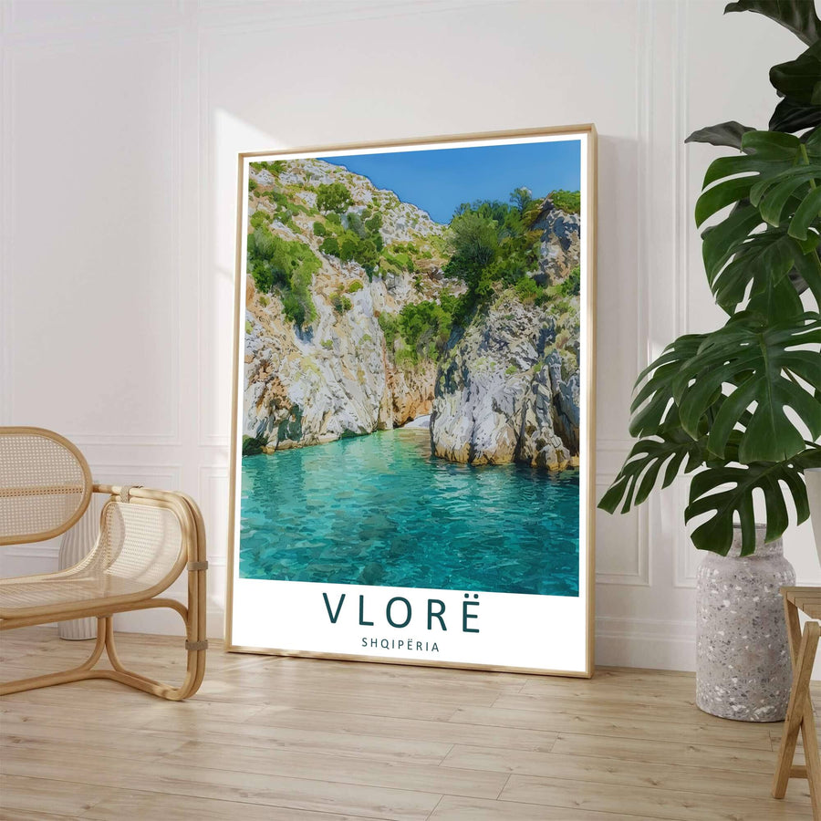 A clean contemporary vector illustration captures the dramatic landscape of the southern Albanian coast framed by vertical gorge walls and sparkling sea beneath a bright sapphire sky. Customers can select from unframed archival paper stock, custom wood frames, or gallery canvas wraps to suit their home decor style.