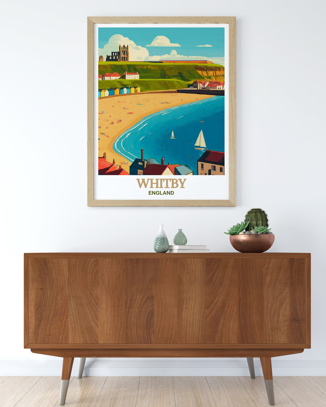 Whitby Beach travel print featuring the expansive coastline and the majestic Abbey in the distance. This poster is perfect for adding a serene, historical touch to any room, offering a glimpse of the stunning Yorkshire coast.