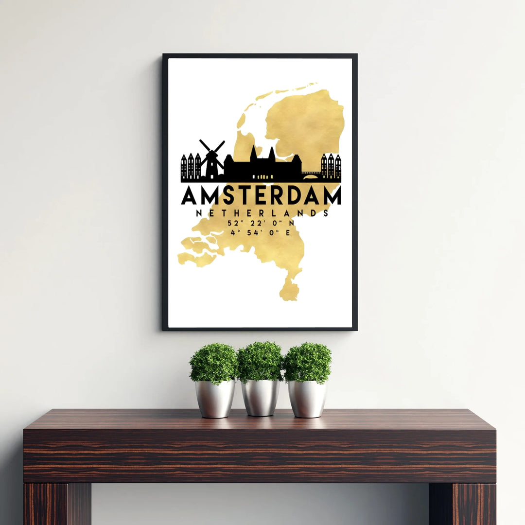 Architectural silhouette poster combining a metallic gold Netherlands country map with black Amsterdam canal house outlines, presented by MapYourDreams with selection choices for fine art unframed paper prints, gallery stretched canvas art, or high-end custom frame choices to suit any setup.