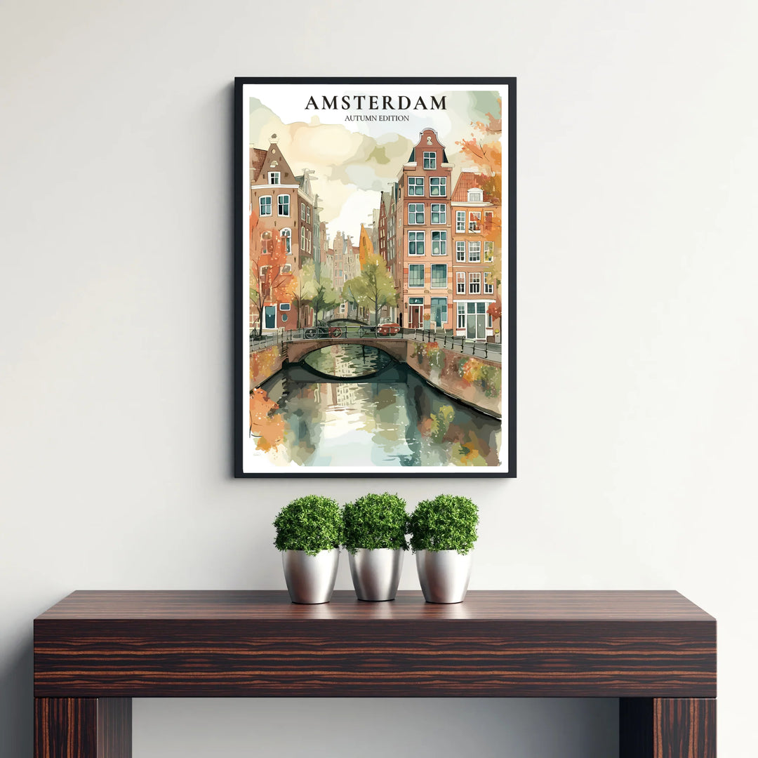 Colorful watercolor wall art showing orange autumn leaves framing a quiet canal bridge in Amsterdam Netherlands, offered by MapYourDreams with catalog choices including fine art unframed paper prints, gallery canvas decor, or custom framed wall art for entryway displays.