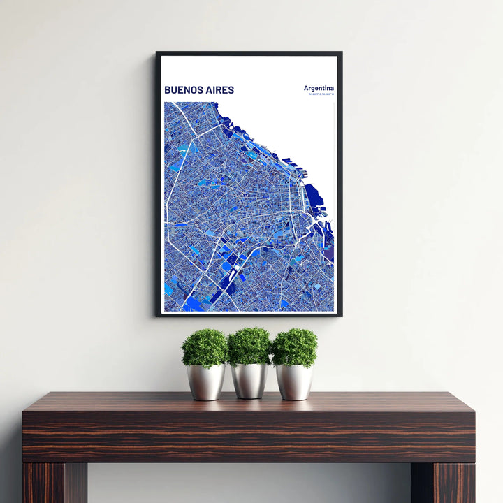 Vibrant blue and white map poster depicting the full metropolitan layout of Buenos Aires along the Río de la Plata waterfront. Offered by MapYourDreams, customers can choose between standalone paper prints, ready-to-hang wooden frames, and gallery canvas wraps.