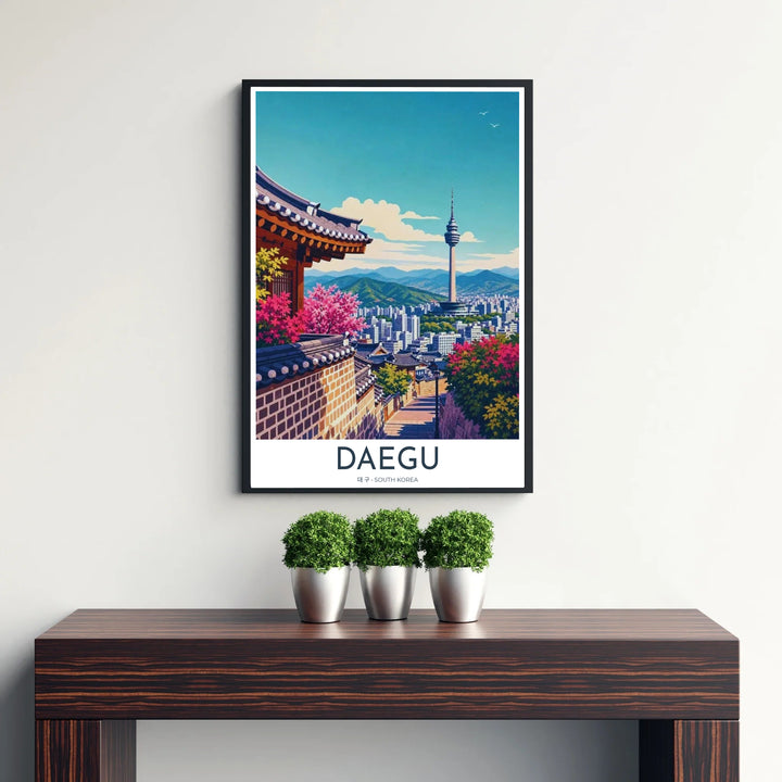 Picturesque Korean city art print featuring 83 Tower standing tall above the cityscape of Daegu, South Korea, framed by traditional Hanok tiles and vibrant pink blossoms. Offered by MapYourDreams, this artwork is available in flexible options including unframed paper, custom wooden frames, and gallery canvas wraps.