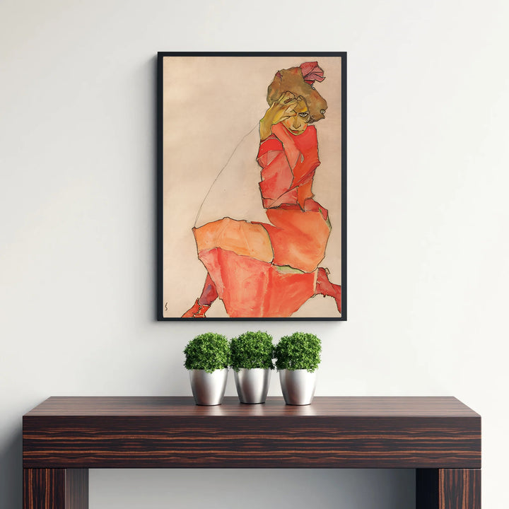 Archival fine art figure print of Egon Schiele Kneeling Female In Orange Red Dress 1910 displayed at Leopold Museum Vienna with realistic crayon stroke details. MapYourDreams features quality framed wall decor, unframed poster prints, and stretched canvas options designed for neutral and modern interior layouts.