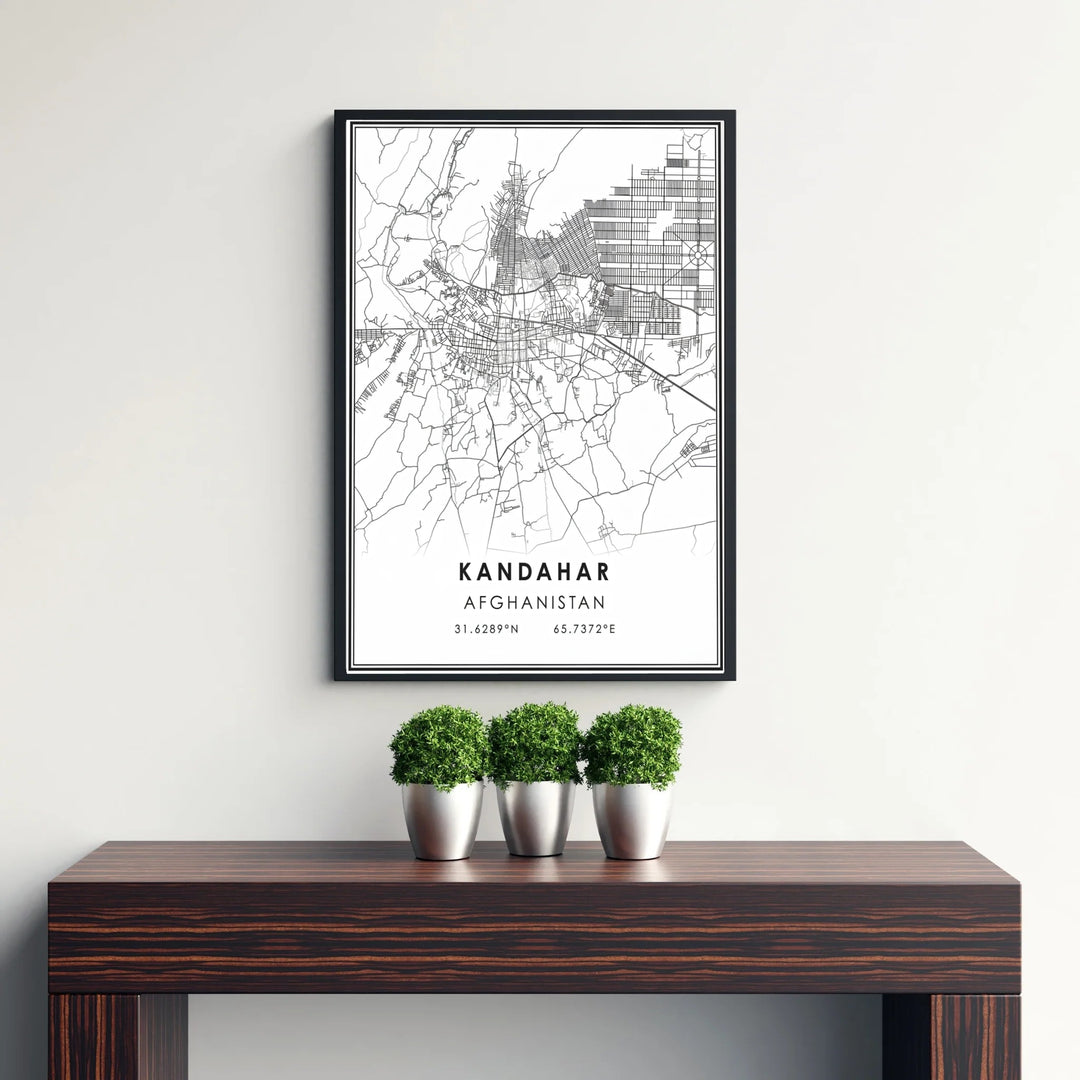Minimalist cityscape street map wall print of Kandahar, Afghanistan, displaying sharp black road paths, residential grids, and coordinates. Crafted by MapYourDreams as an unframed art print, a stretched canvas wall decor item, or a custom framed wall print in pure gold and silver frames for entryway displays.