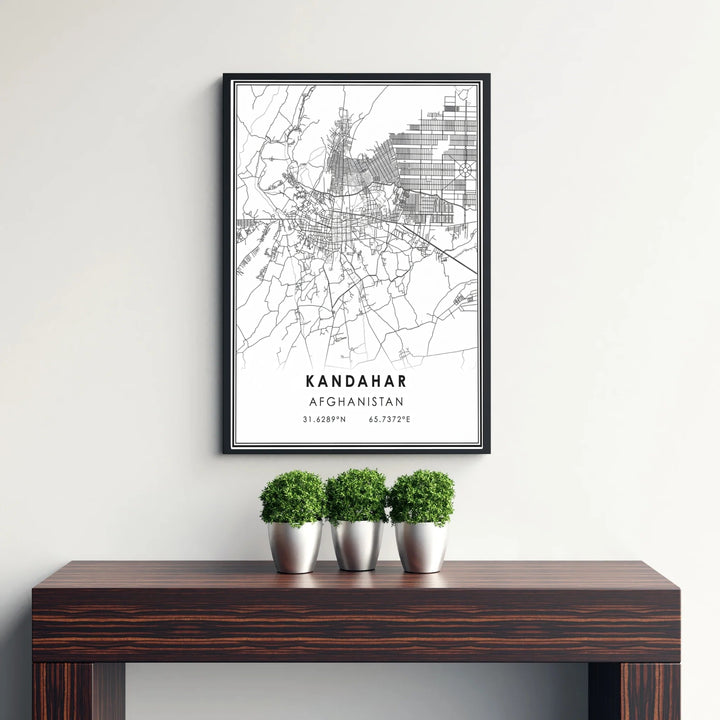 Minimalist cityscape street map wall print of Kandahar, Afghanistan, displaying sharp black road paths, residential grids, and coordinates. Crafted by MapYourDreams as an unframed art print, a stretched canvas wall decor item, or a custom framed wall print in pure gold and silver frames for entryway displays.