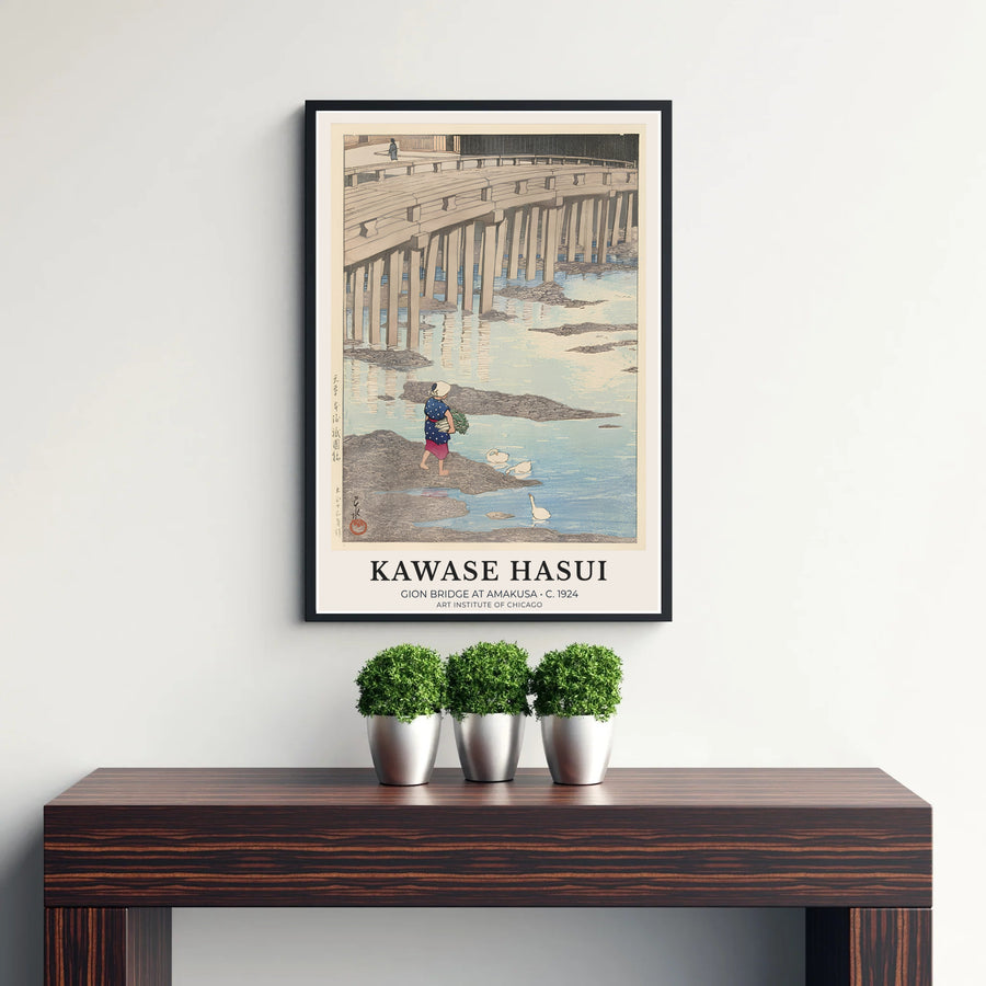Japanese Shin-hanga woodblock poster Gion Bridge at Amakusa by artist Kawase Hasui showcasing indigo working clothes and stone pillars at Gion Bridge in Amakusa. Discover custom framed, unframed, and canvas print decor options at MapYourDreams.