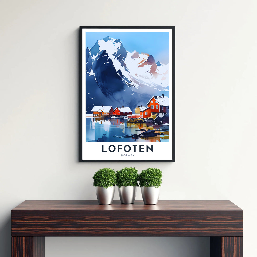 Iconic Scandinavian art print depicting the serene rorbuer huts of Lofoten Norway nestled against giant snow-capped mountains. Perfect for art enthusiasts, this wall decor selection includes lightweight unframed paper prints, solid wood framed prints, and gallery wrapped canvas wall decor options.