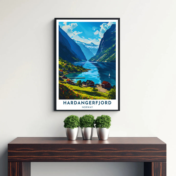Detailed graphic art of Hardangerfjord Norway displaying red village homes, a wooden pier, and distant snow-capped mountain peaks. Created by MapYourDreams, this landscape piece is offered across multiple formats including custom framed prints, premium stretched canvas artwork, and classic unframed poster options.