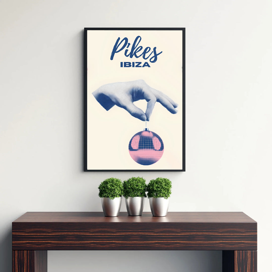 Vintage style Pikes Ibiza hotel graphic print displaying navy blue script text and pop-art disco ball details, created by MapYourDreams with options for unframed poster prints, stretched canvas wall art, or custom frames in retro black and retro white moulding.