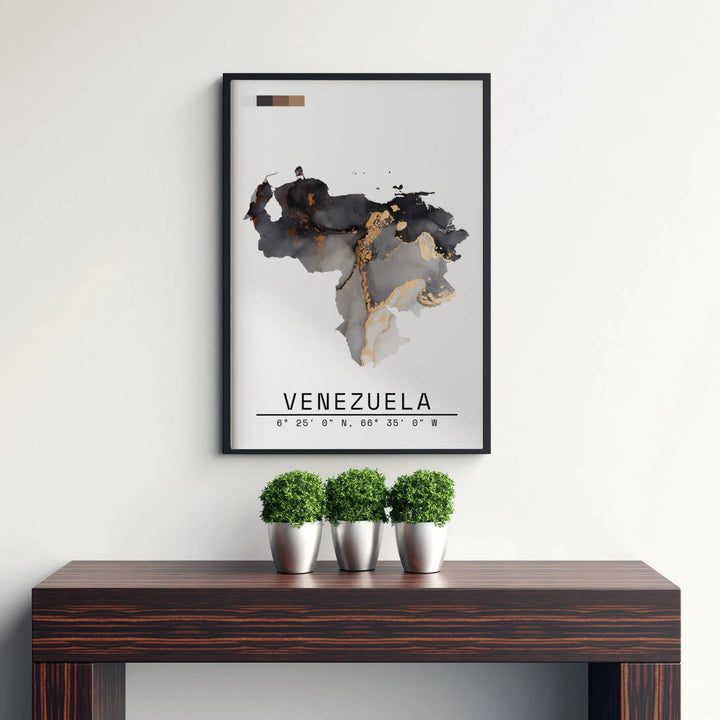 High-contrast charcoal black, sepia, and metallic gold wall art showing the abstract fluid ink map silhouette of Venezuela. Curated by MapYourDreams, this wall piece offers customizable choices such as archival paper prints, real wood frames, or canvas wraps.
