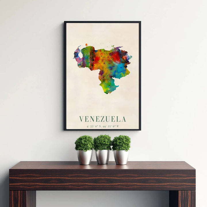 High-contrast rainbow watercolor wall art showing the paint splatter map silhouette of Venezuela on textured off-white paper. Curated by MapYourDreams, this wall piece offers customizable choices such as archival paper prints, real wood frames, or canvas wraps.