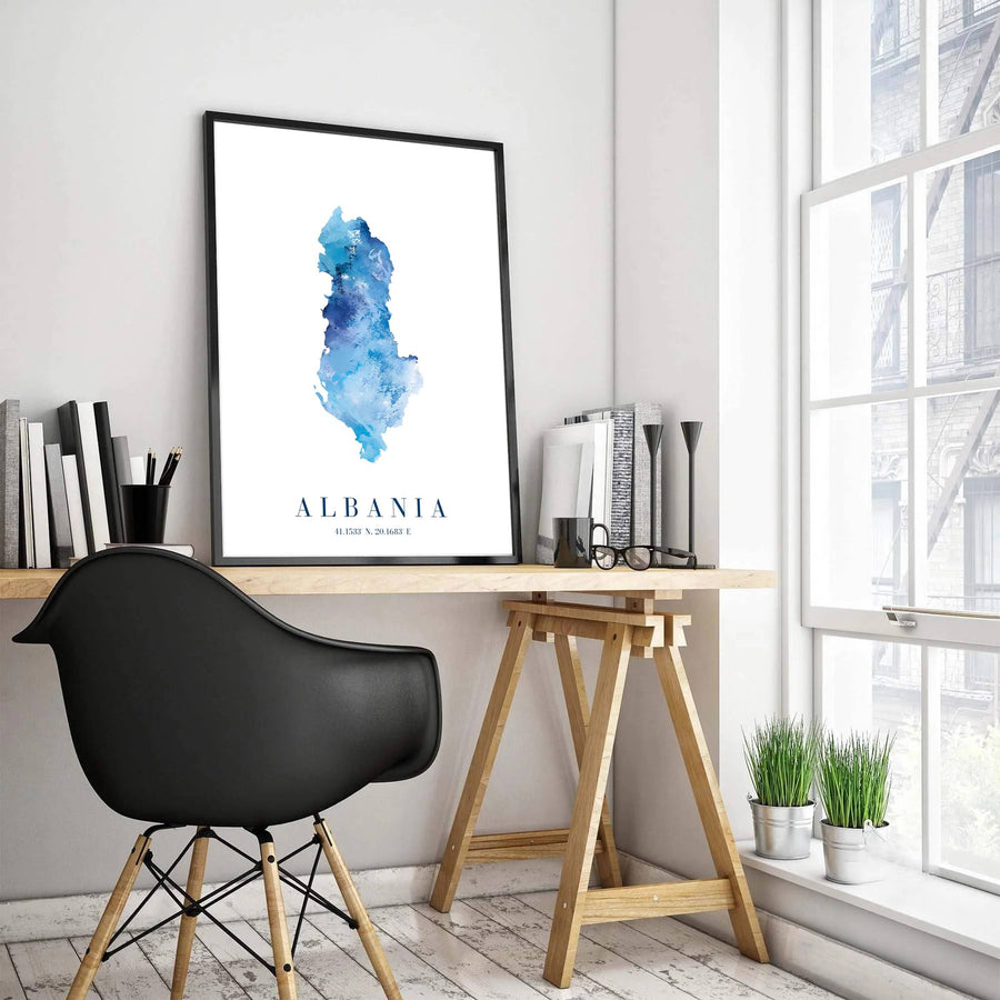 Detailed map art print of Albania with latitude and longitude details, rendered in layered sapphire blue watercolor textures on premium paper stock. Offered by MapYourDreams, this artwork is available in flexible options including unframed paper, custom wooden frames, and gallery canvas wraps for room decor.