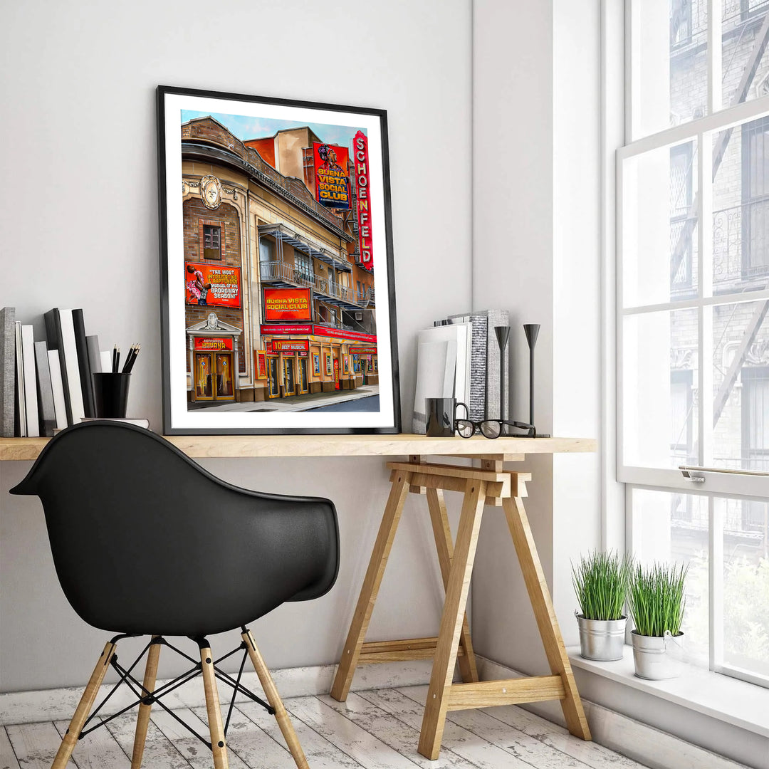 NYC Broadway landmark poster depicting the detailed brickwork, balcony railings, and glowing promotional signs at the Gerald Schoenfeld Theatre on West 45th Street, created by MapYourDreams with choices available for an unframed paper print, a gallery canvas, or custom framed wall art.