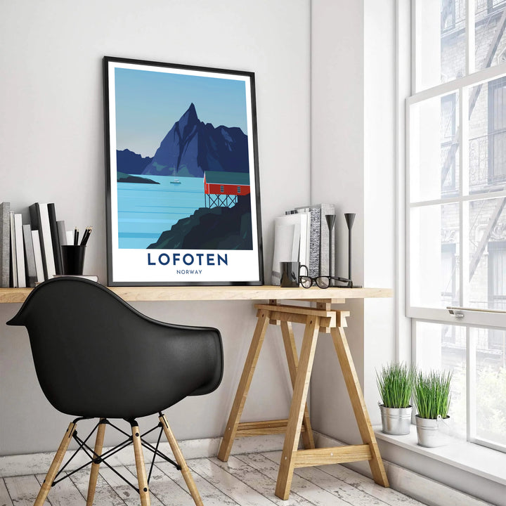 Scandinavian travel poster illustrating the quiet shoreline of Lofoten Norway with a solitary red cabin and a tall mountain summit in the background. Upgrade your interior layout with options ranging from archival unframed paper prints to sturdy framed posters and textured canvas setups.