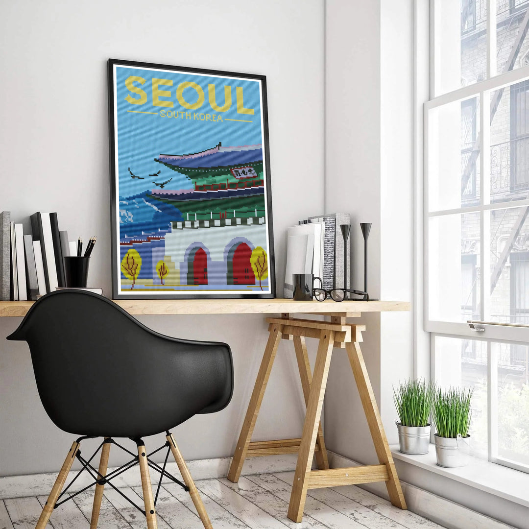 Pixelated needlework travel art print of Gwanghwamun Gate in Seoul, South Korea, capturing the stone masonry wall, grand arched portals, jade green pavilion, and distant mountain skyline. Offered by MapYourDreams, this artwork is available in flexible options including unframed paper, custom wooden frames, and gallery canvas wraps.