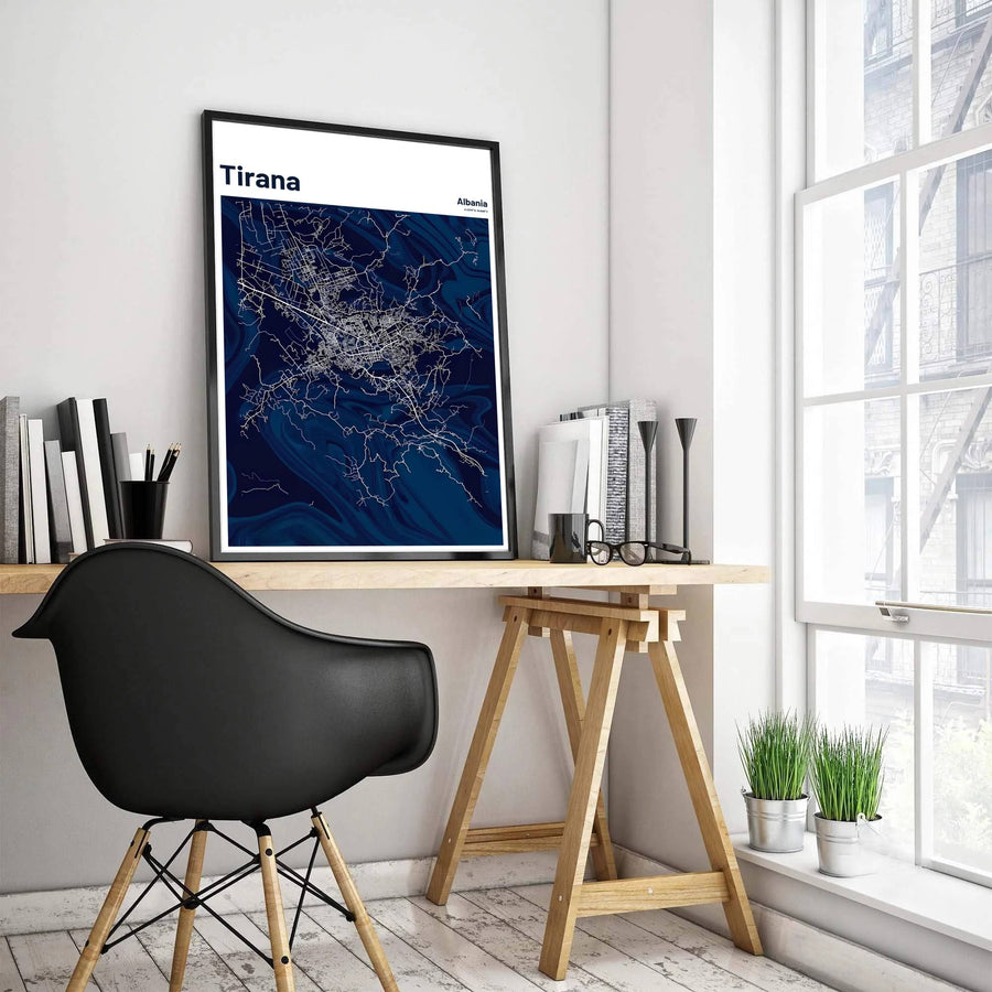 Featuring the vibrant street grid of central Tirana in sharp white contrast against swirling indigo tones, this road map print celebrates Albania&
