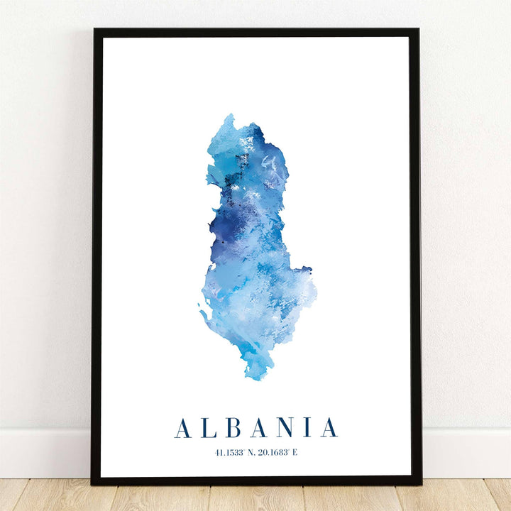 Highlighting the geographical silhouette of Albania in ocean blue watercolor, this country map poster displays precise coordinates 41.1533° N, 20.1683° E at the bottom center. Offered by MapYourDreams, this artwork is available in flexible options including unframed paper, custom wooden frames, and gallery canvas wraps for room decor.