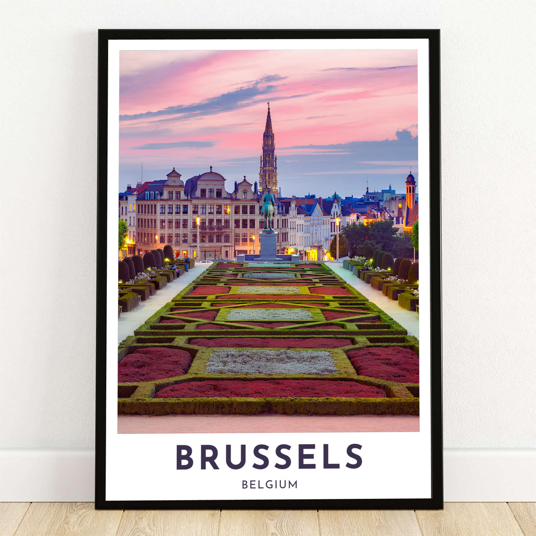 A breathtaking photographic travel poster capturing the manicured hedges of Mont des Arts garden at sunset in Brussels, Belgium, with the Town Hall spire piercing a pink sky. Offered by MapYourDreams, this artwork is available in flexible options including unframed paper, custom wooden frames, and gallery canvas wraps.