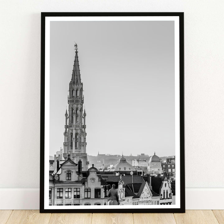 A fine art black and white cityscape photography print featuring the majestic Brabantine Gothic spire of the Town Hall in Brussels, Belgium. Offered by MapYourDreams, this artwork is available in flexible options including unframed paper, custom wooden frames, and gallery canvas wraps.